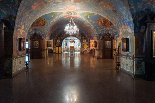 Ornate Orthodox Church Crypt With Frescoes, Icons and Central Chandelier Over Marble Floor. Pechersky Monastery in Nizhny Novgorod, Russia.