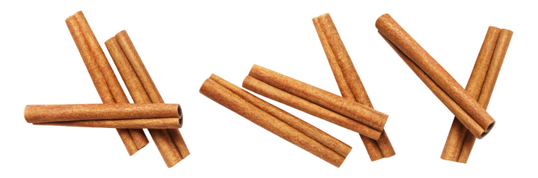 Collection of aromatic cinnamon sticks arranged in groups, isolated on transparent cutout background