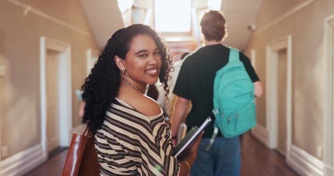Face, student and walk at college with smile, scholarship and start semester for exchange program. Portrait, happy woman and books in lobby for next lecture, university lesson and academic knowledge