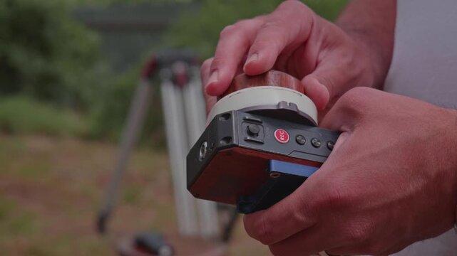 Focus Puller Turning Wireless Remote Focus Wheel on Professional Film Set