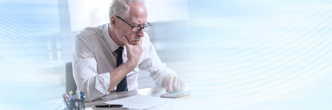 Businessman doing his accounting; panoramic banner