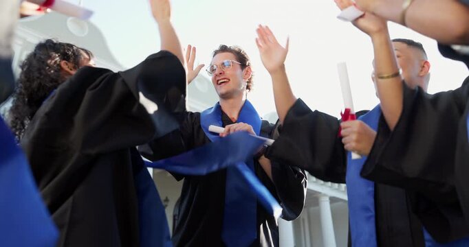 Excited, friends and high five at graduation for diploma, success or applause for degree completion. Cheering, people or clap with scroll on campus for collective achievement, goals or graduate class