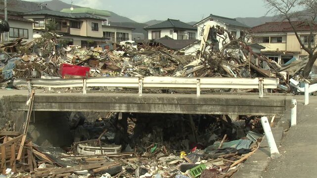 Piles Of Debris In Destroyed Neighborhood In Aftermath Of Tsunami In Japan