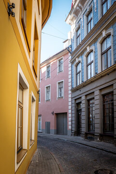 Colorful Historic Buildings Along a Narrow Cobblestone Street