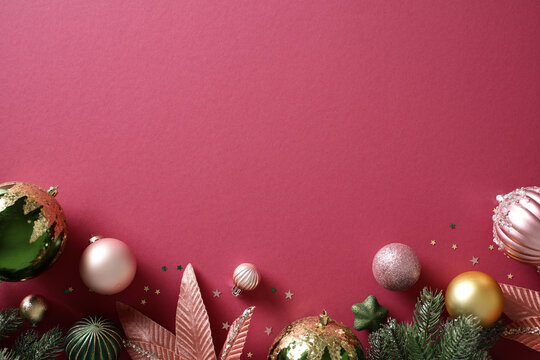 Christmas baubles and decorations on pink background
