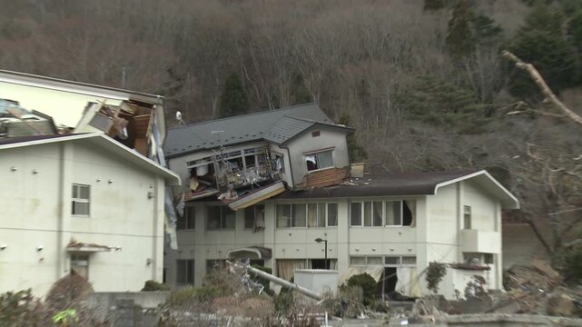 House Rests Of Roof Of Building In Aftermath Of Tsunami In Japan