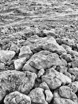 Geological, construction, environmental design projects. Rocky textures, gravel piles, uneven surface details suitable for backgrounds, textures, and landscape concepts.