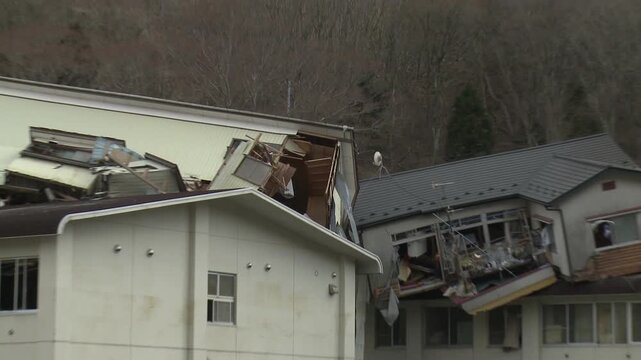 Building Lie On Top Of Each Other In Aftermath Of Tsunami In Japan
