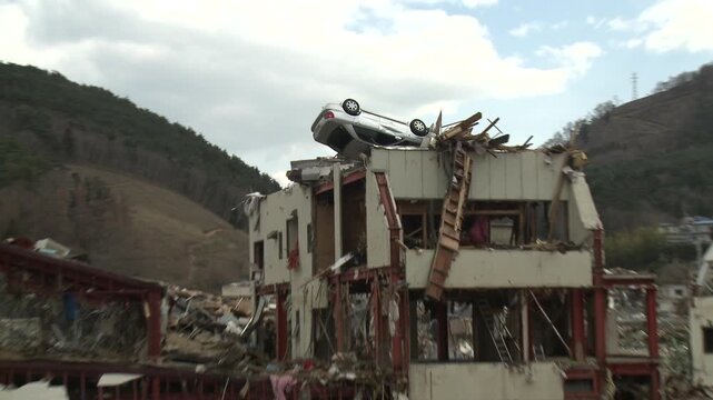 Car Washed Onto Roof Of Tall Building In Aftermath Of Tsunami In Japan