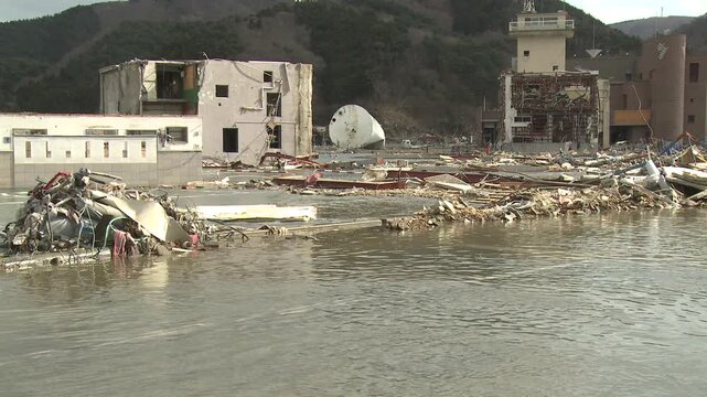 Flood Waters In Coastal Town Hit By Tsunami In Japan