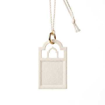 Elegant miniature luxury product tag made from textured ivory paper with a polished metal ring and delicate silk cord, designed for jewelry, fragrance, fashion, and premium boutique packaging.