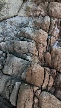 Close view of volcanic basalt rock texture at Monsul Beach in Cabo de Gata Almeria Spain, dramatic geological formation, natural landscape, Mediterranean coast and volcanic heritage