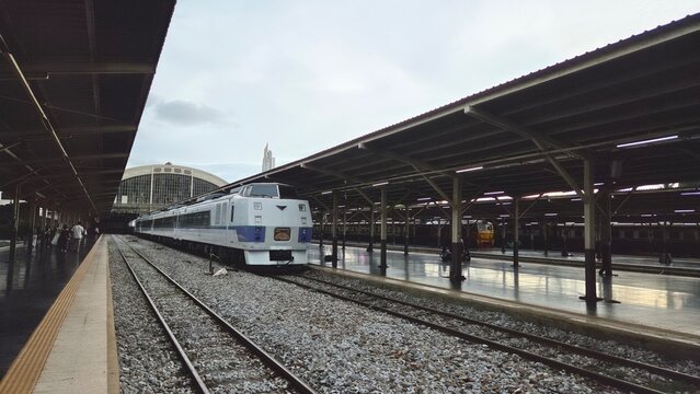 Thai passenger train at Hua Lamphong Railway Station with covered platforms, multiple tracks and the iconic arched station structure in Bangkok, Thailand. BKK, Thailand. 22 Sep 2026