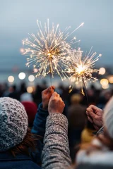 Joyful sparklers celebration, Friends cheerful with glowing sparklers during evening festivities, Candid moment of friends smiling and having fun with sparklers outdoors © neirfy