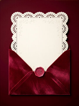 Burgundy velvet envelope with wax seal and blank lace invitation card