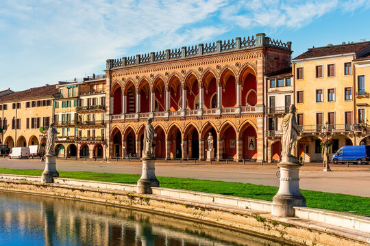 beautiful city view of an urban landscape with park chanel with blue water and monuments and historic european buildings on background. Autumn season city landscape
