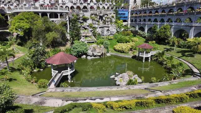 Garden pond with gazebo at Simala Shrine in Cebu