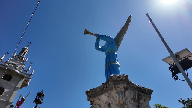 Blue angel statue blowing trumpet at Simala Shrine, Cebu