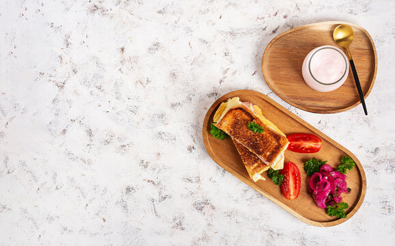 Breakfast Toast Sandwich Served with Fresh Vegetables and yogurt. Top view