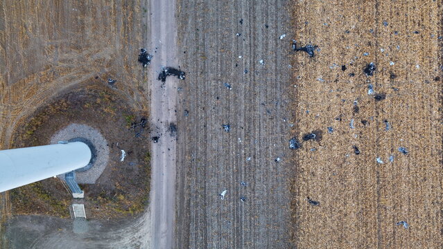 Aerial view of wind turbine debris scattered across an agricultural field next to a turbine base in Vladimirovac, Vojvodina, Serbia.