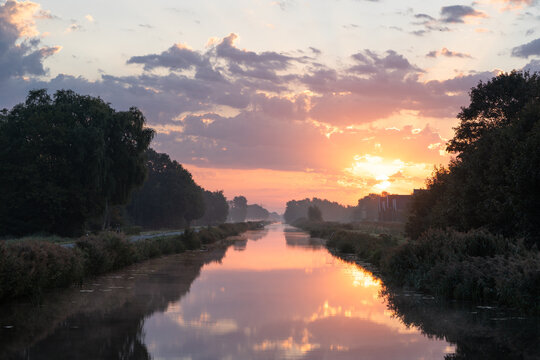 A tranquil, foggy dawn over a canal in the countryside. Meerstad, the Netherlands.