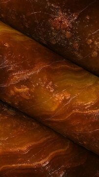 Soft Natural Baltic Amber Columns Turning with Subtle Texture and Distinctive Surface Details in a Refined Architectural Composition for Luxury Interior Design Projects