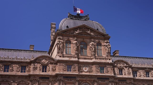 Ornate Louvre Palace Architecture and French Flag in Paris