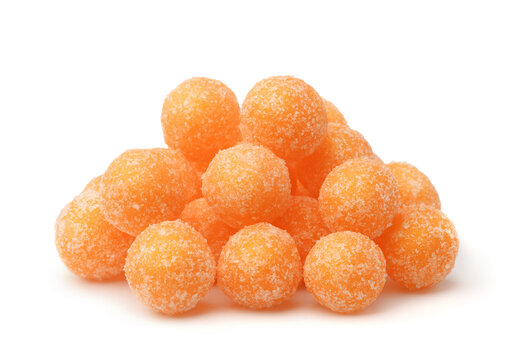 Pile of round orange sugar candies