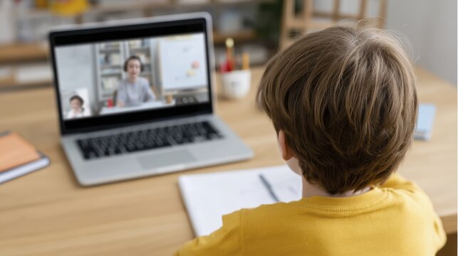 Child engaged in online learning session at home