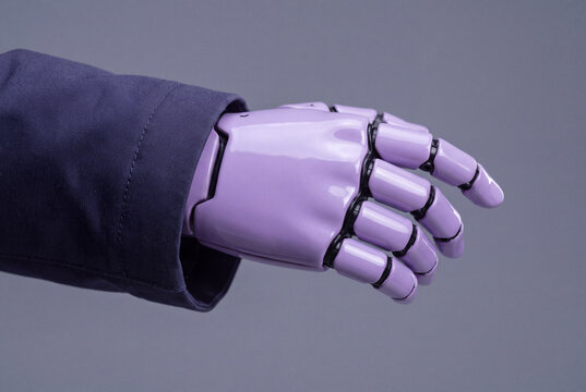 Close-up of glossy lavender robot hand emerging from indigo coat sleeve
