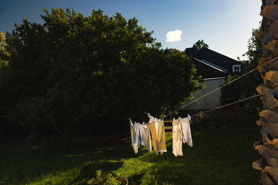 clothes on clothes line  blowing in wind early morning 