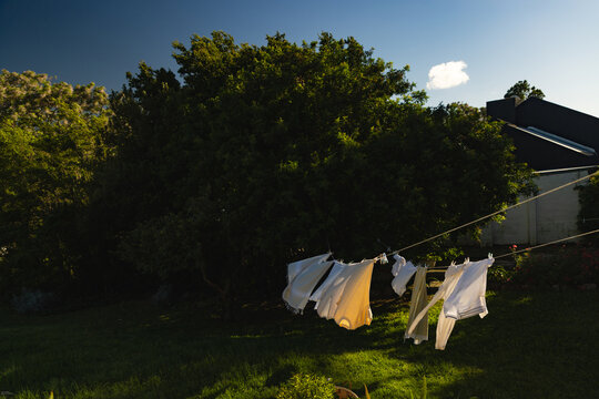 clothes on clothes line  blowing in wind early morning 
