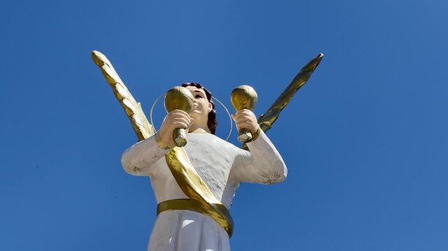 White angel statue with golden wings at Simala Shrine, Cebu