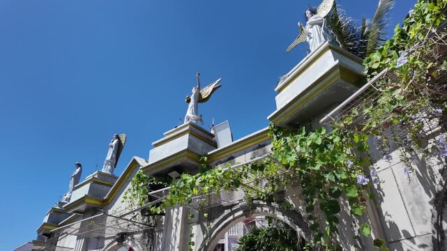 Angel statues on building facade at Simala Shrine, Cebu