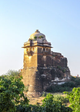View of the historic Rohtas Fort with its weathered stone walls, domed structure, and surrounding greenery in Dina, Punjab, Pakistan.