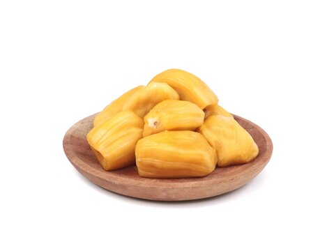 Fresh and sweet ripe jackfruit bulbs served on a rustic wooden plate, isolated on a clean white background. Delicious tropical fruit rich in vitamins and healthy nutrition