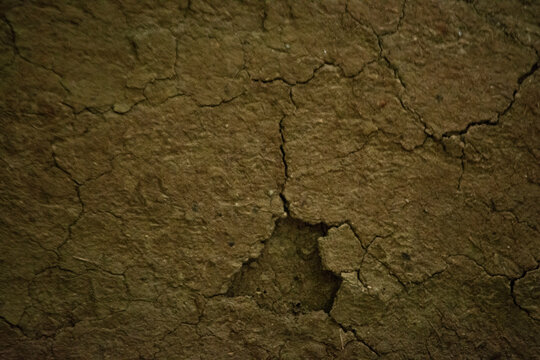 Cracked Weathered Wall Surface with Peeling Plaster Texture