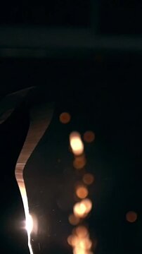 Tricking sport - man performs martial arts in front of bright sparkles - slow-motion