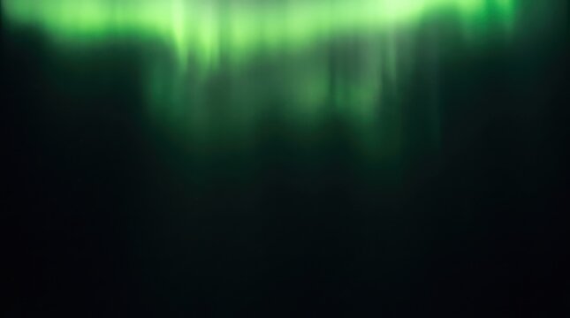 Bright green aurora borealis lights glowing in the dark night sky creating a beautiful natural phenomenon abstract background
