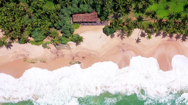 Ocean waves reaching a tropical Sri Lanka beach from above
