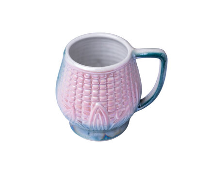 Light pink and blue decorated ceramic mug isolated over white background