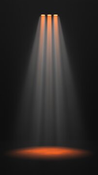 Three beams of orange light shine down from above, illuminating a dark, textured surface with a soft glow