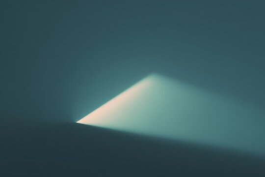 A triangle in the middle of a dark blue background illuminated by a soft light. the triangle is in the center of the with the light emanating from it creating a mysterious and atmosphere.