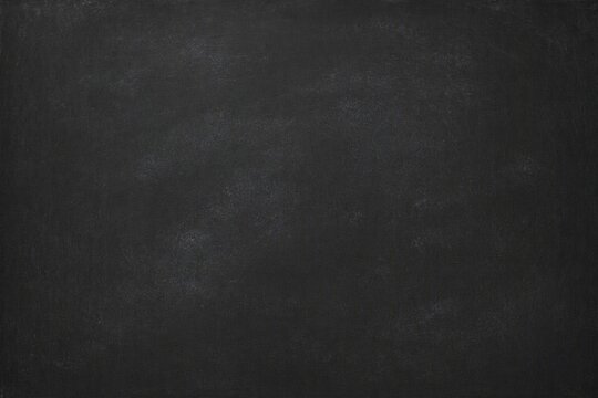 Black chalkboard texture background offers matte dark surface for educational and creative projects.