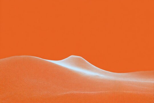 An orange sand dune in the sahara desert with the sky in the background. the sand is a vibrant orange color and the sky is a deep clear blue.