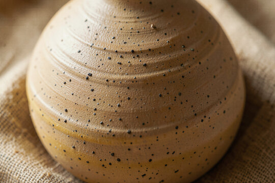 x-default Macro shot of unglazed ceramic stoneware clay with iron oxide specks