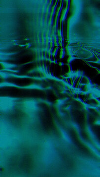 Abstract teal water glitch with vertical scanline ripple distortion and chromatic aberration on dark background. Lives in retrofuturism and campaign design for electronic music and social media reels.