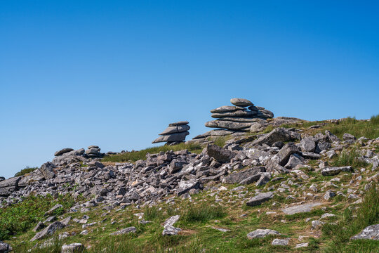 View of the Cheesewring granite rock formation set within the rugged moorland landscape of Minions, Cornwall, United Kingdom.