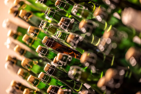 self-bottled Prosecco bottles in the wine cellar