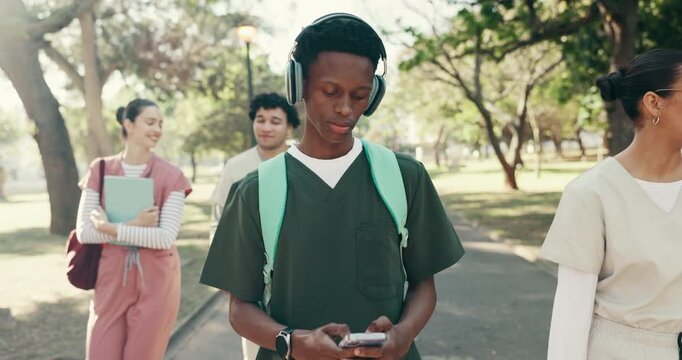 Headphones, phone and medical student or man in park for future, healthcare and opportunity. Doctor program, nursing internship and music with person outdoor for residency training and podcast